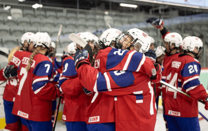 Top 10 Best Women’s Ice Hockey Teams in 2025 3 Top 10 best women’s ice hockey teams in 2025 standing on rink after championship game with national flags